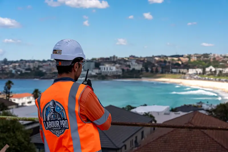 Labour Pro Group worker in orange hi-vis overlooking Bondi, Sydney